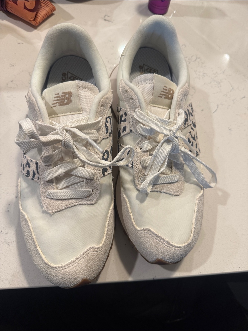 New Balance Women’s White Sneakers with Leopard Accent